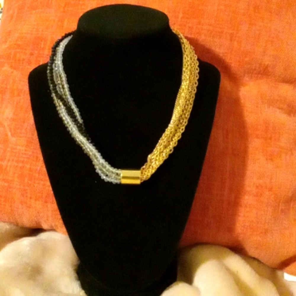 Two color sided necklace..unique. gold and clear and black beaded.
